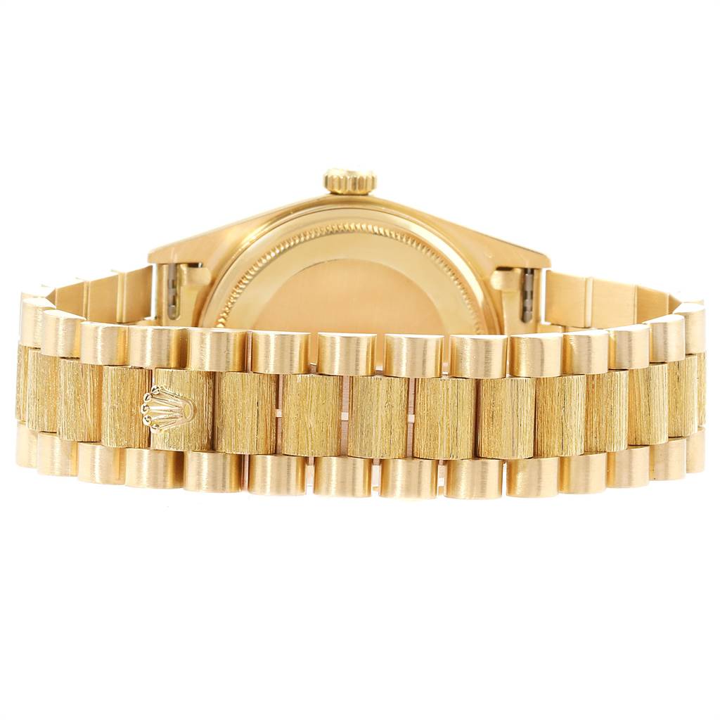 The image shows the back of the Rolex President 18078 Men
s Yellow Gold Black Dial 18078 Men
s Yellow Gold Black Dial model watch, highlighting its gold case, crown, and bracelet.