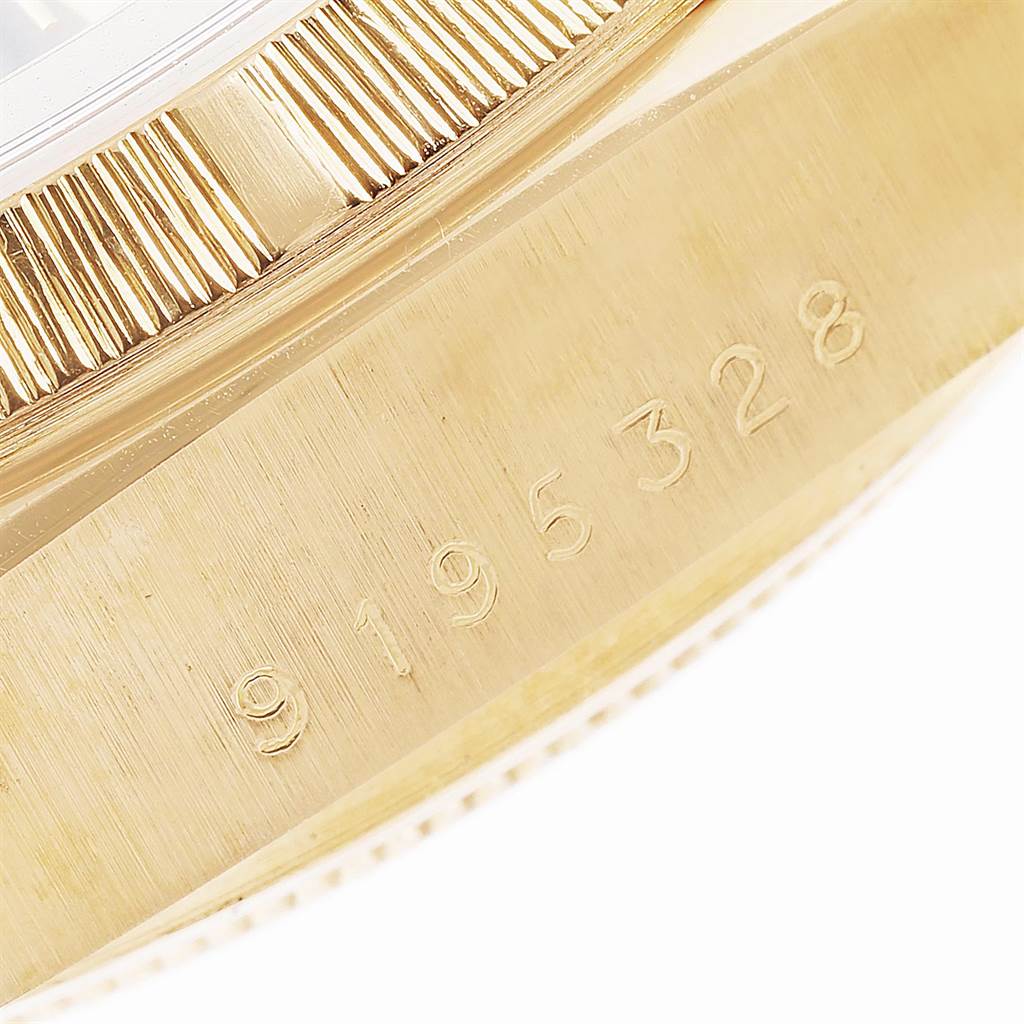 This close-up image shows the fluted bezel and engraved model number on the side of a Rolex President 18078 Men
s Yellow Gold Black Dial 18078 Men
s Yellow Gold Black Dial watch.