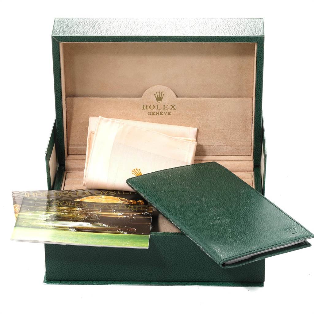 This image shows the open box, warranty card, and booklet of a Rolex President 18238 Men
s Yellow Gold Champagne Dial 18238 Men
s Yellow Gold Champagne Dial model.