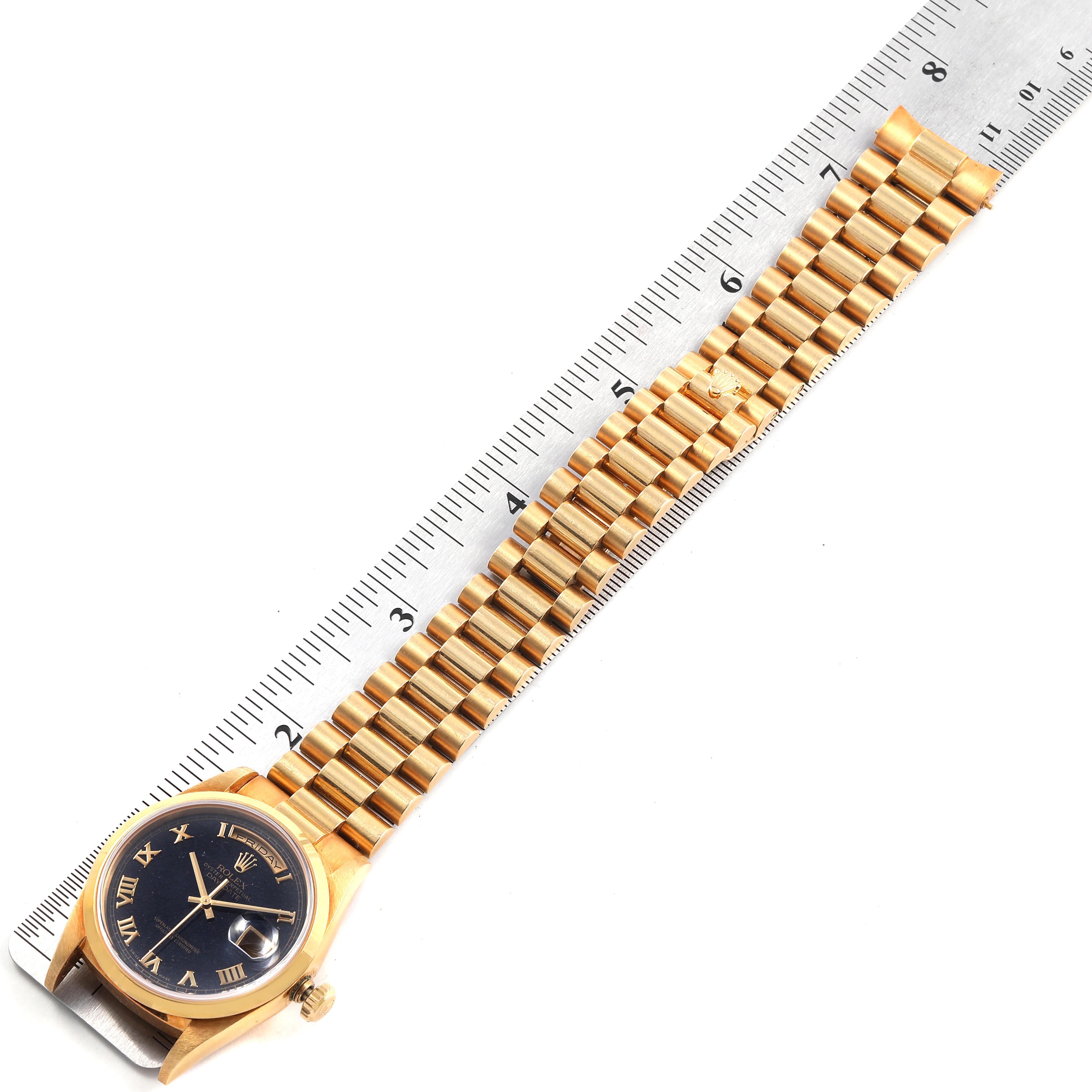 The image shows a Rolex President 18208 Men's Yellow Gold Blue Dial 18208 Men's Yellow Gold Blue Dial model watch placed beside a ruler, displaying the face and full bracelet.