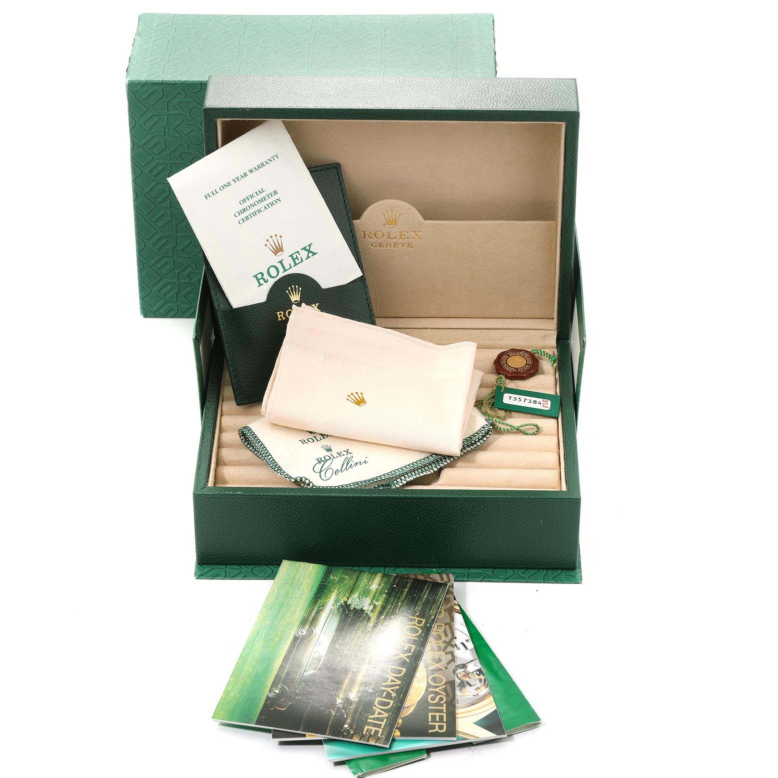 The image shows the packaging accessories for a Rolex President 18208 Men's Yellow Gold Blue Dial 18208 Men's Yellow Gold Blue Dial model, including booklets, tags, a cleaning cloth, and the watch box.