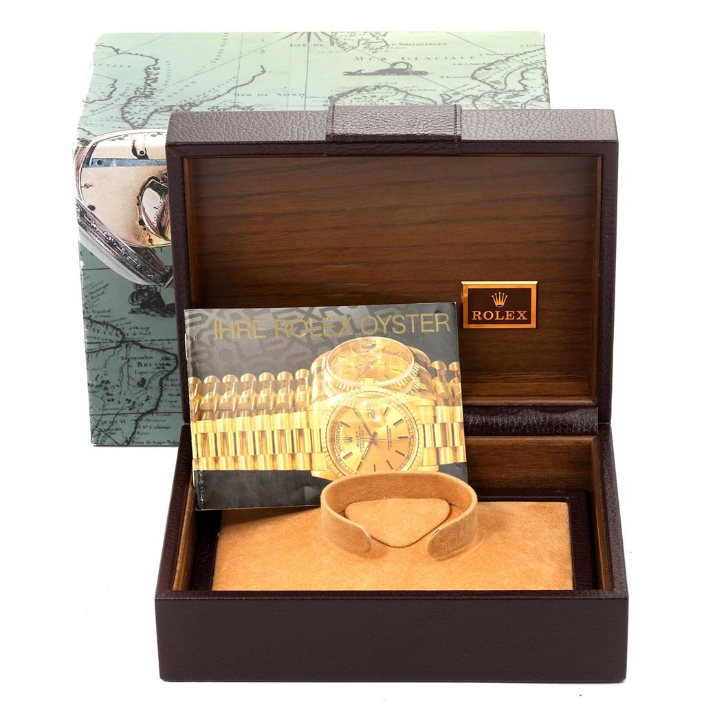 The image shows a Rolex President 18038 Men
s Yellow Gold Champagne Dial 18038 Men
s Yellow Gold Champagne Dial model watch box with booklets and a cushion, viewed from the front.