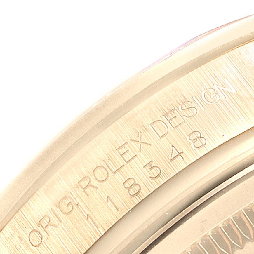 This close-up image shows the engraved edge of the Rolex President 118348 Men
s Yellow Gold Mother of Pearl Dial 118348 Men
s Yellow Gold Mother of Pearl Dial model, displaying part of the model number.