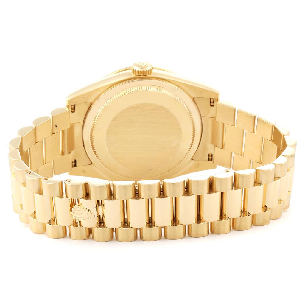 The image shows the back case and the bracelet of a Rolex President 118348 Men
s Yellow Gold Mother of Pearl Dial 118348 Men
s Yellow Gold Mother of Pearl Dial model watch at a rear angle.