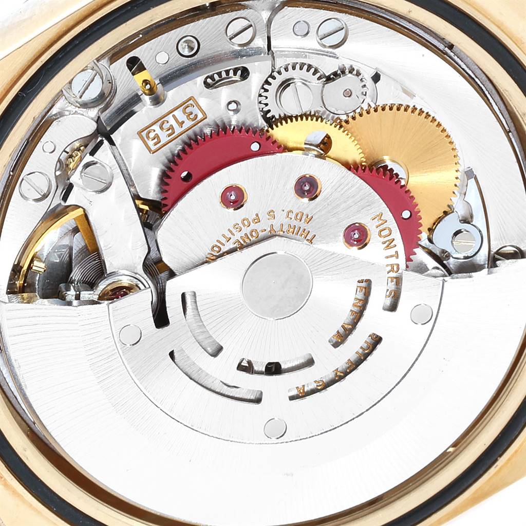 The image shows the intricate internal mechanism and gears of a Rolex President 18238 Men's Yellow Gold Black Dial 18238 Men's Yellow Gold Black Dial model watch.
