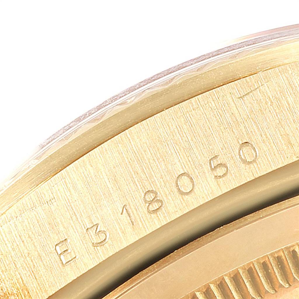 This image shows a close-up of the casing and serial number of a Rolex President 18238 Men
s Yellow Gold Champagne Dial 18238 Men
s Yellow Gold Champagne Dial model watch.