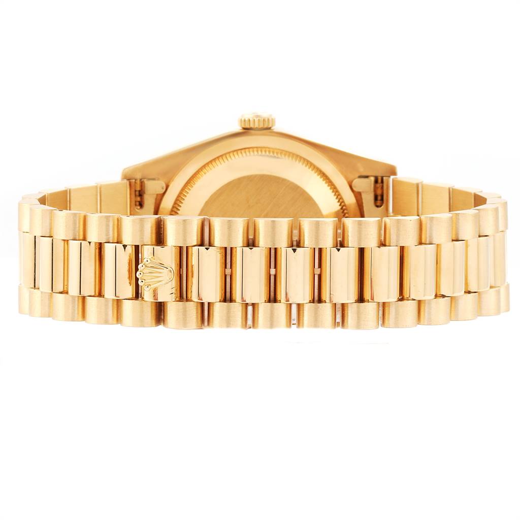 The image shows the back view of a Rolex President 18238 Men
s Yellow Gold Champagne Dial 18238 Men
s Yellow Gold Champagne Dial model watch, focusing on the gold bracelet and case back.