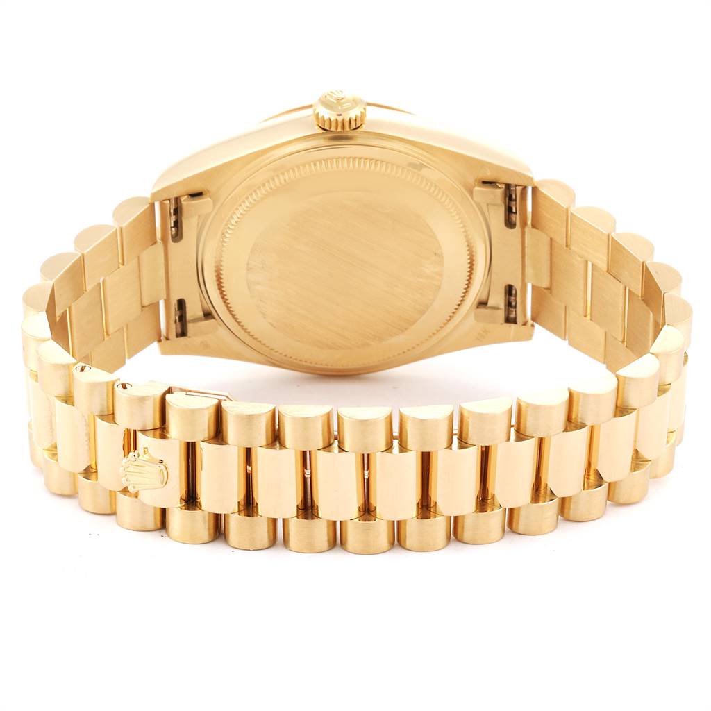 The image shows the back, crown, and bracelet of a gold Rolex President 18038 Men
s Yellow Gold Champagne Dial 18038 Men
s Yellow Gold Champagne Dial model watch.
