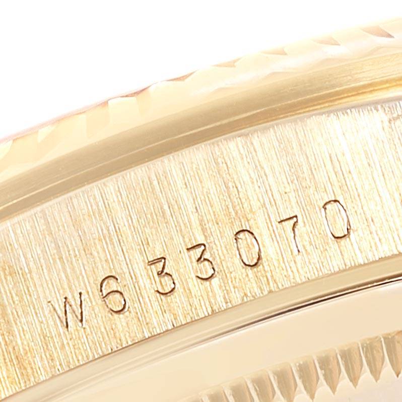 The image shows a close-up of the serial number engraved on the case side of a Rolex President 18238 Men
s Yellow Gold Champagne Dial 18238 Men
s Yellow Gold Champagne Dial model watch.
