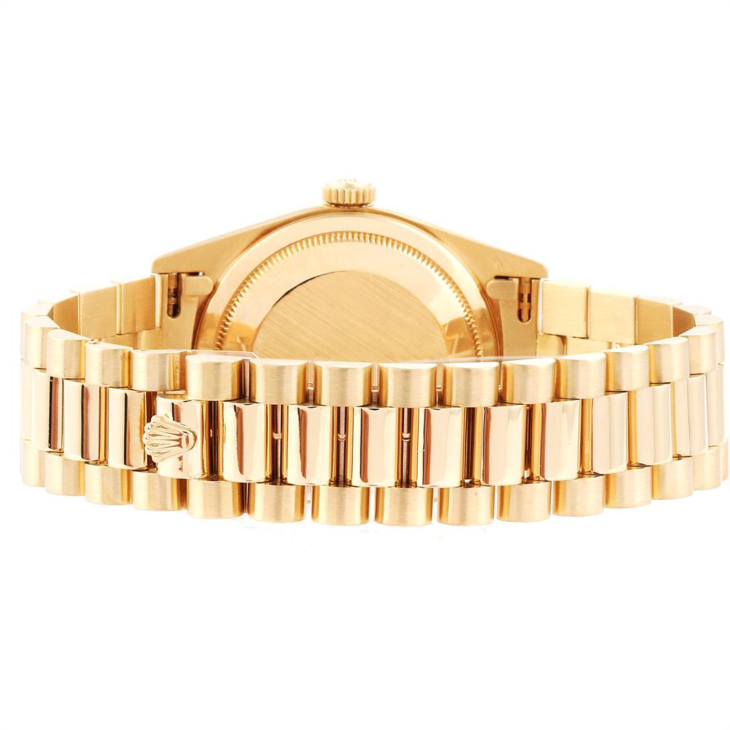 The image shows the back view of the Rolex President 18238 Men
s Yellow Gold Champagne Dial 18238 Men
s Yellow Gold Champagne Dial model watch, highlighting its gold case and bracelet.