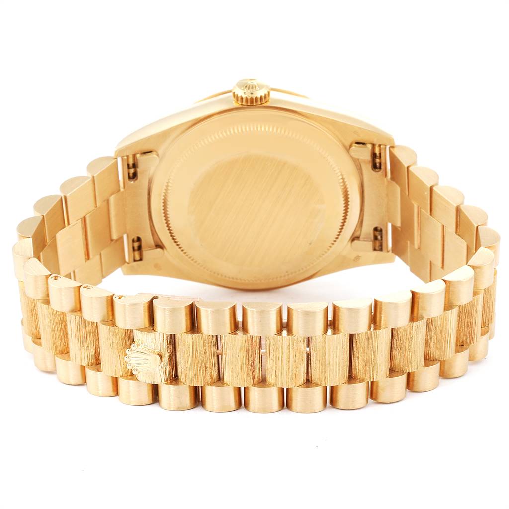 The image shows the back case and bracelet of a Rolex President 18248 Men
s Yellow Gold Champagne Dial 18248 Men
s Yellow Gold Champagne Dial model watch at an angled rear view.