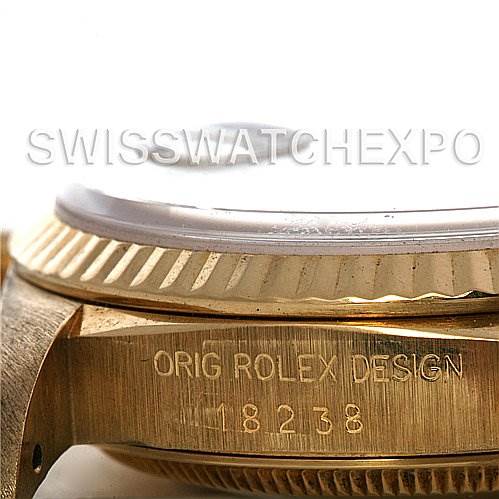 This image shows a close-up side view of the Rolex President 18238 Men's Yellow Gold White Dial 18238 Men's Yellow Gold White Dial model's watch case with the model number etched on it.
