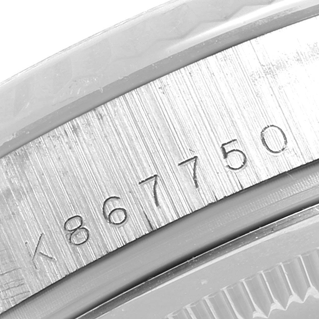 This image shows a close-up of the engraved serial number on the side of a Rolex President 118239 Men's White Gold Silver Dial 118239 Men's White Gold Silver Dial model watch.