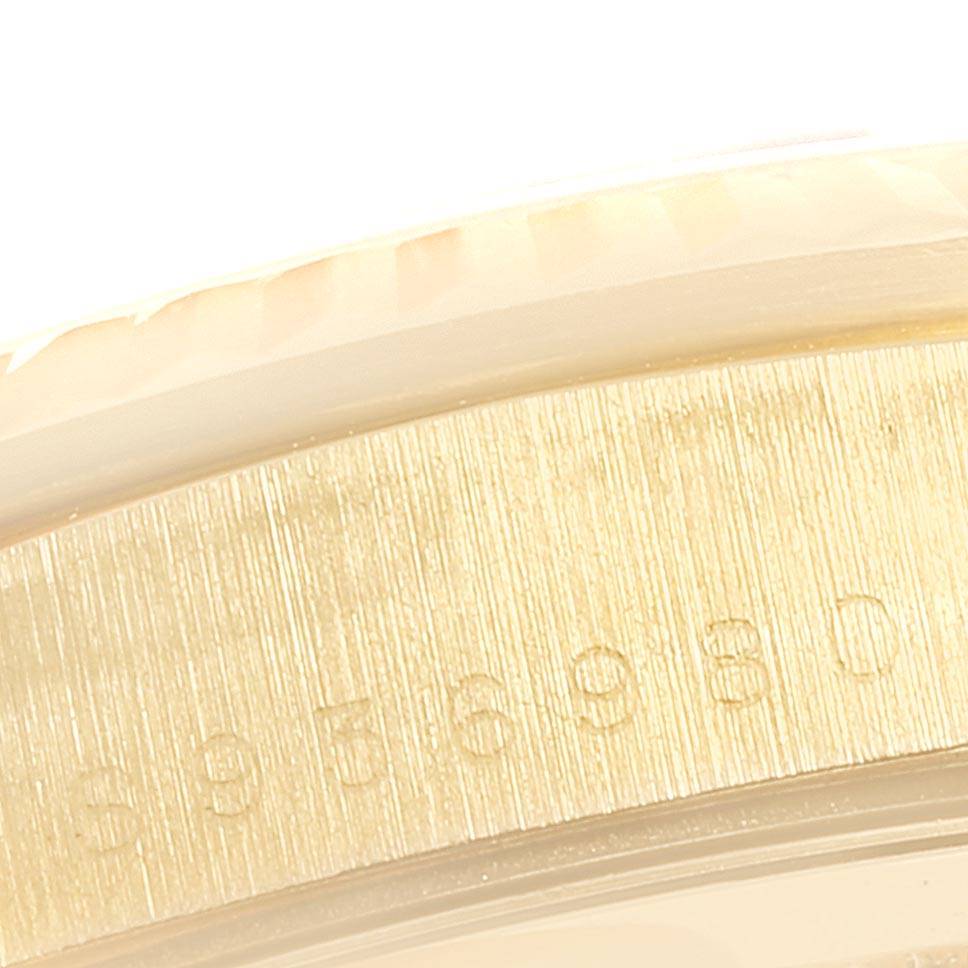 This image shows a close-up of the engraved serial number on the side of a President model Rolex watch.