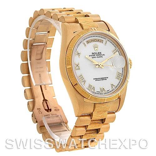 This image shows a side angle of the Rolex President 18248 Men's Yellow Gold White Dial 18248 Men's Yellow Gold White Dial Day-Date watch, highlighting its gold bracelet, case, and white dial with Roman numerals.