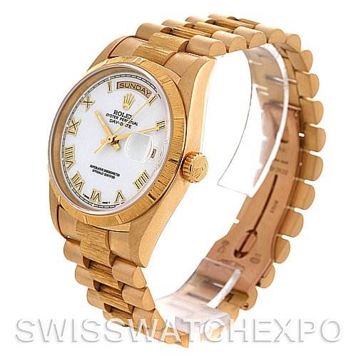 This image shows a side angle of the Rolex President 18248 Men's Yellow Gold White Dial 18248 Men's Yellow Gold White Dial model, highlighting the watch face, crown, and bracelet.