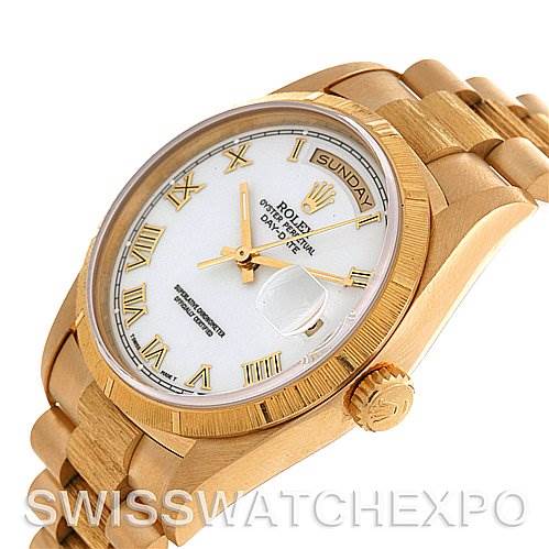 This image shows a Rolex President 18248 Men's Yellow Gold White Dial 18248 Men's Yellow Gold White Dial model watch at an angle highlighting its dial, bezel, and bracelet.
