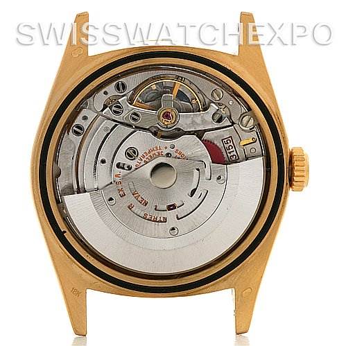 The image shows the back view of a Rolex President 18248 Men's Yellow Gold White Dial 18248 Men's Yellow Gold White Dial model watch, highlighting its internal mechanical movement.