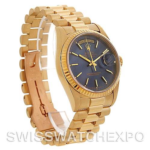 This image displays a side angle of a Rolex President 18238 Men's Yellow Gold Blue Dial 18238 Men's Yellow Gold Blue Dial watch, showcasing its gold bracelet, black dial, and day-date complications.