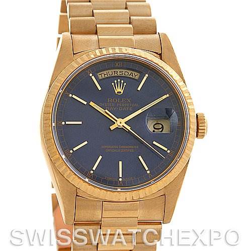 This image shows a front view of a Rolex President 18238 Men's Yellow Gold Blue Dial 18238 Men's Yellow Gold Blue Dial model watch with a gold band and blue dial displaying the day and date.