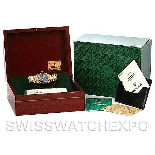The image shows a Rolex President 18238 Men's Yellow Gold Blue Dial 18238 Men's Yellow Gold Blue Dial watch in its box at an oblique angle, along with its outer packaging, warranty card, and cleaning cloth.