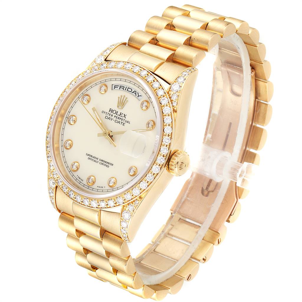 The image shows a Rolex President 18388 Men's Yellow Gold White Dial 18388 Men's Yellow Gold White Dial watch angled to display its gold band, diamond-studded bezel, and white dial with day-date details.