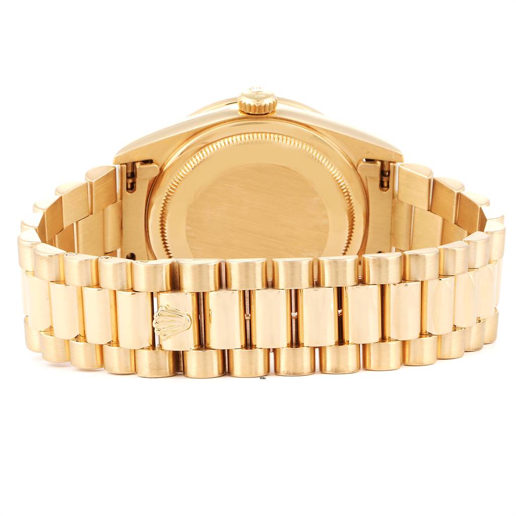 The image shows the rear view of a gold Rolex President 18388 Men's Yellow Gold White Dial 18388 Men's Yellow Gold White Dial model, highlighting the case back, bracelet, and clasp.