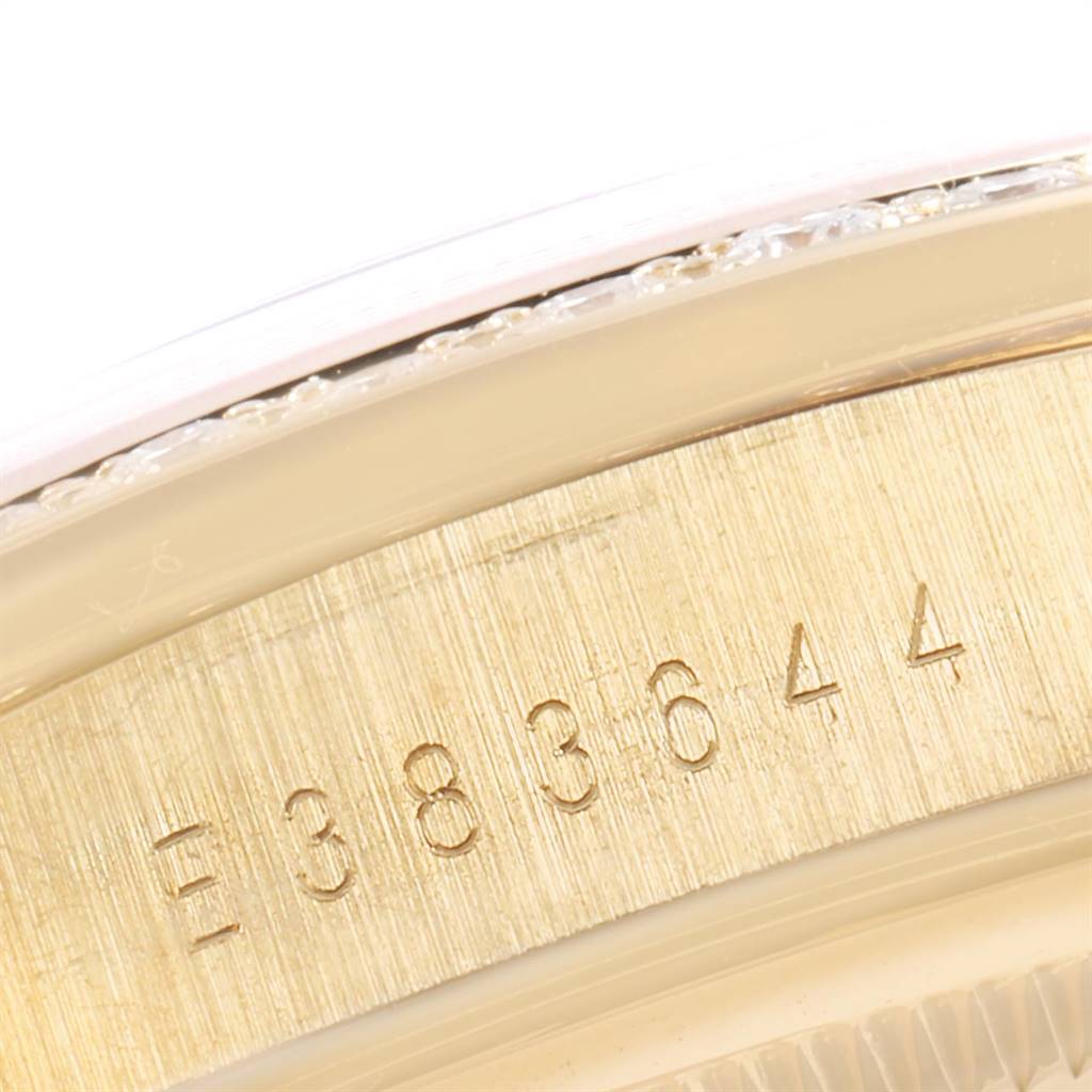This image shows a close-up of the serial number engraving on the case of a Rolex President 18388 Men's Yellow Gold White Dial 18388 Men's Yellow Gold White Dial model watch.