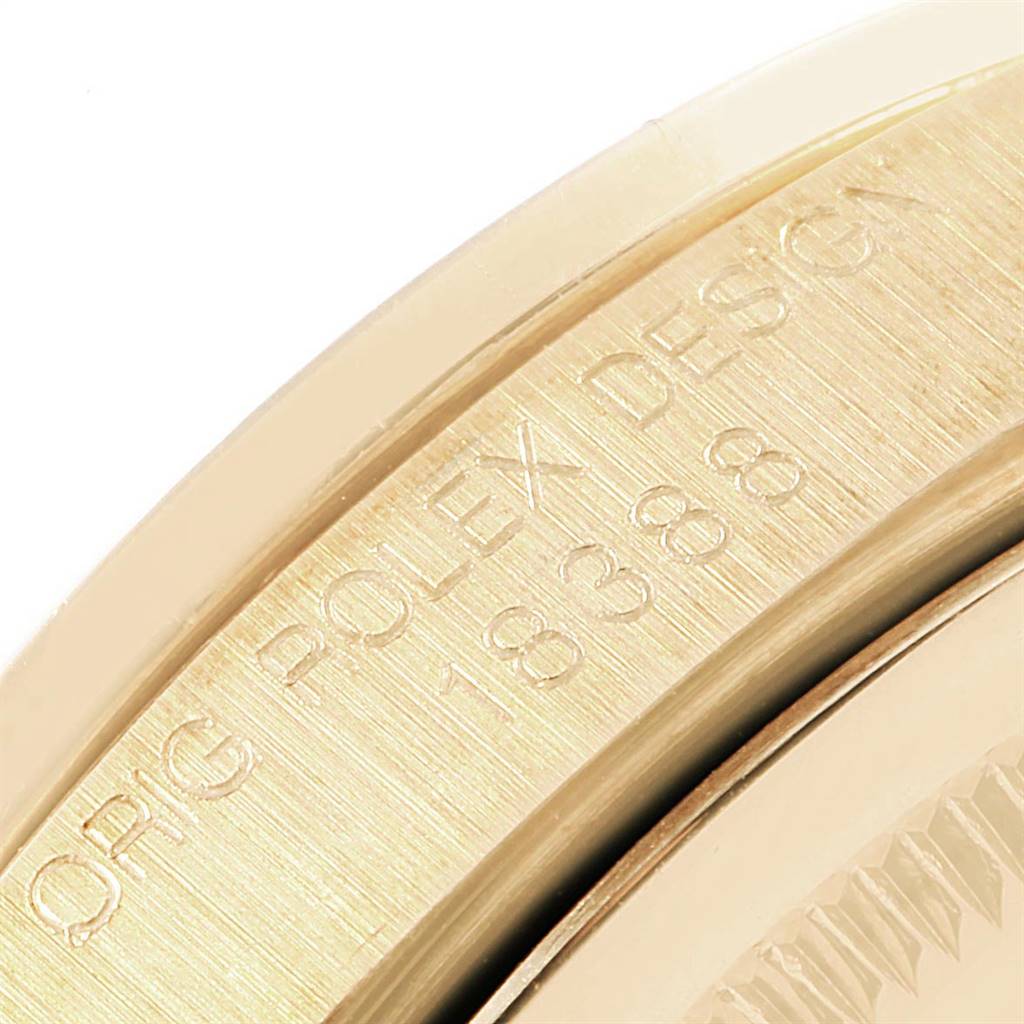 The image shows the engraved side of a Rolex President 18388 Men's Yellow Gold White Dial 18388 Men's Yellow Gold White Dial model watch, featuring its design and model number.