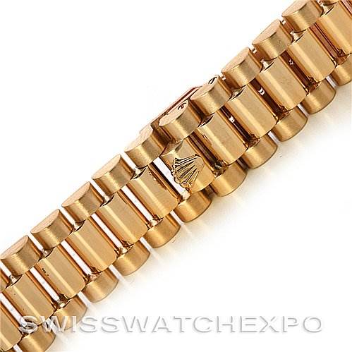 This image shows a close-up of the bracelet of a Rolex President 68278 Yellow Gold Mother of Pearl Dial 68278 Yellow Gold Mother of Pearl Dial model watch, highlighting its gold links and signature crown logo.