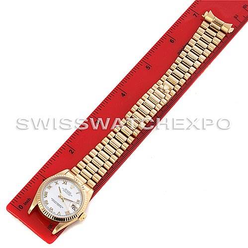 The Rolex President 68278 Yellow Gold Mother of Pearl Dial 68278 Yellow Gold Mother of Pearl Dial model watch is shown from a top-down angle, displaying the dial, case, and full bracelet alongside a ruler.