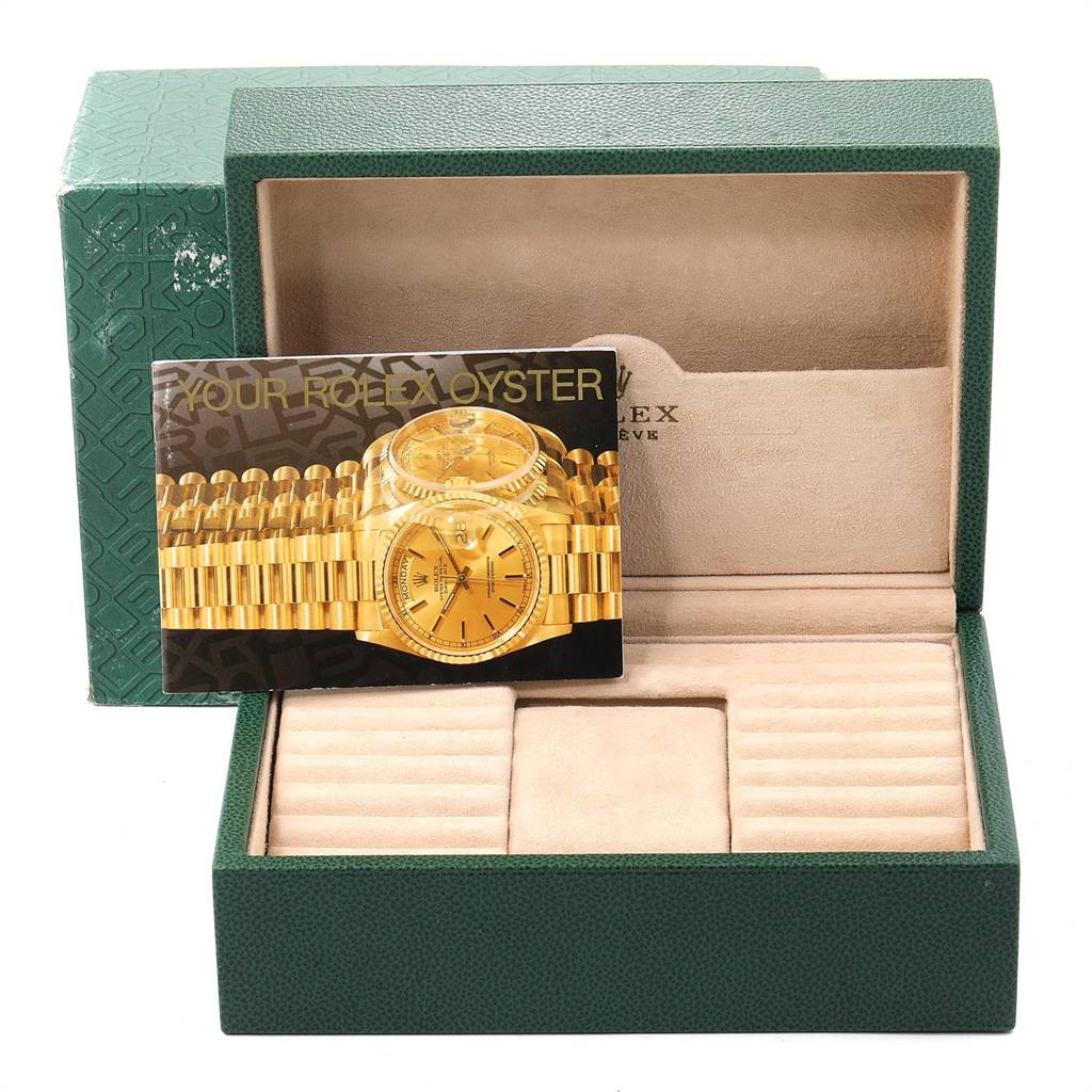 The image shows the display card and the box for the President model by Rolex, with the watch box partially open.
