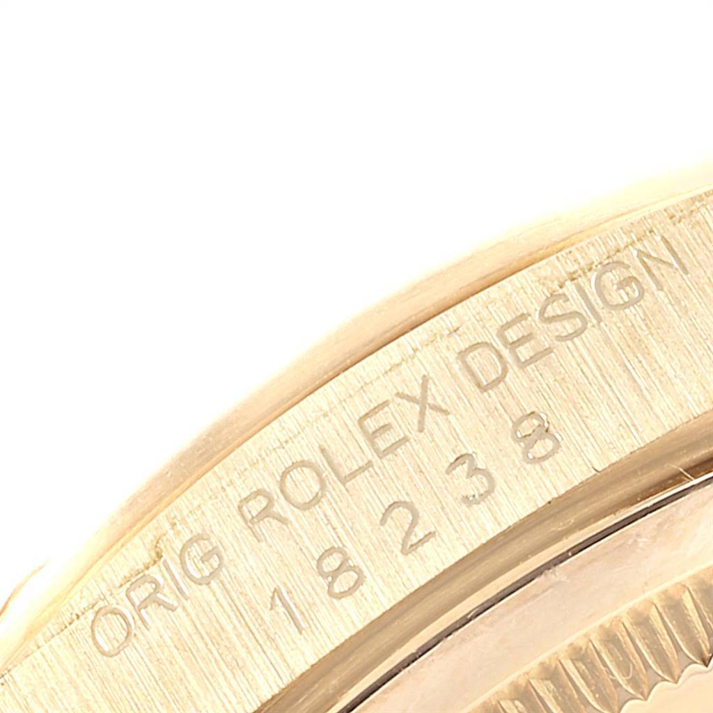 This close-up image shows the model number and brand engraving on the inner bezel of a Rolex President 18238 Men
s Yellow Gold Champagne Dial 18238 Men
s Yellow Gold Champagne Dial watch.