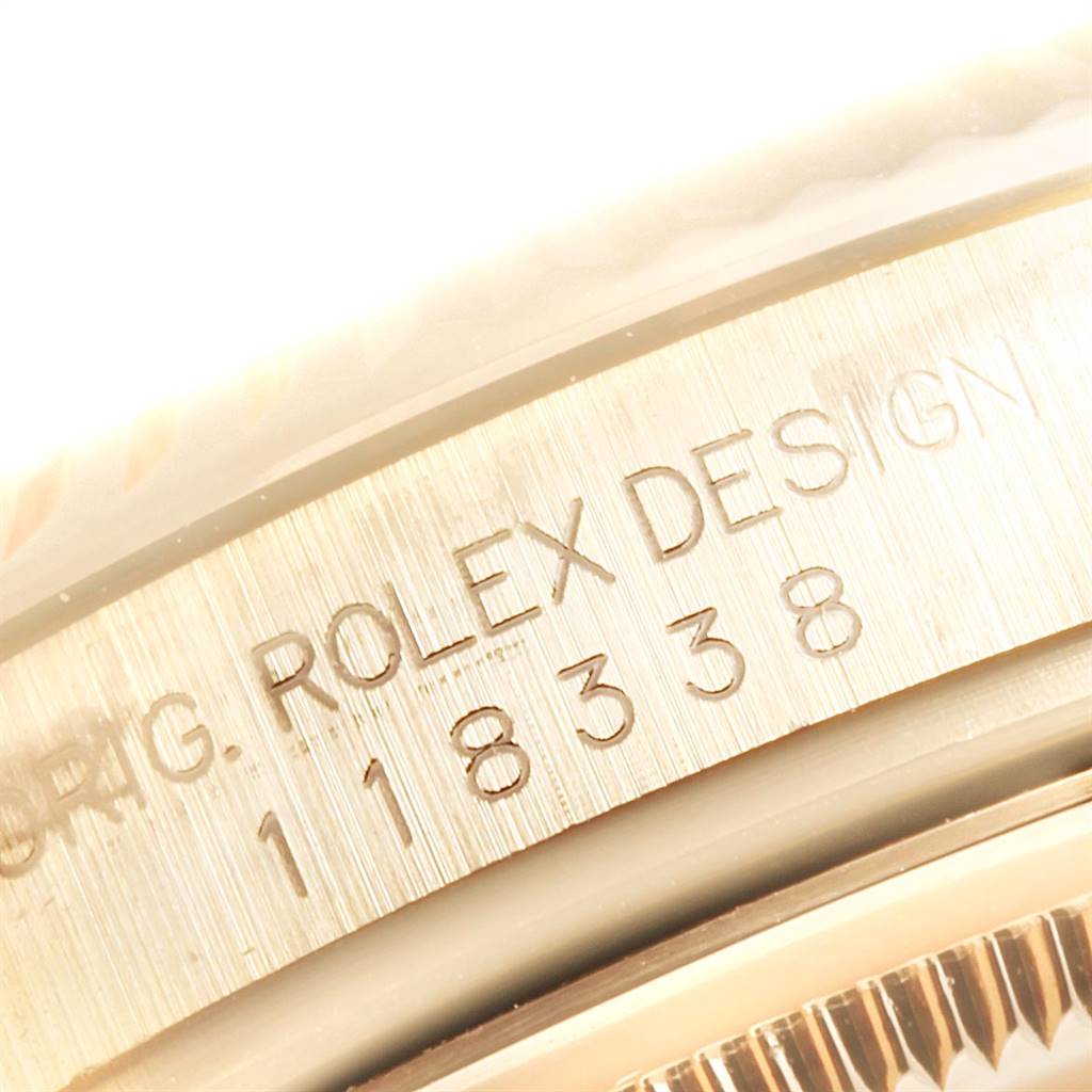 This image shows a close-up of the case engraving on a Rolex President 118338 Men
s Yellow Gold Silver Dial 118338 Men
s Yellow Gold Silver Dial model watch.