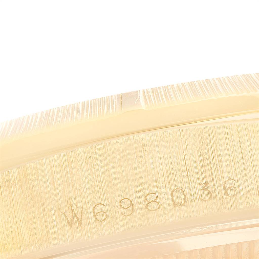The image shows a close-up of the case side and serial number of a Rolex President 18248 Men's Yellow Gold White Dial 18248 Men's Yellow Gold White Dial model.
