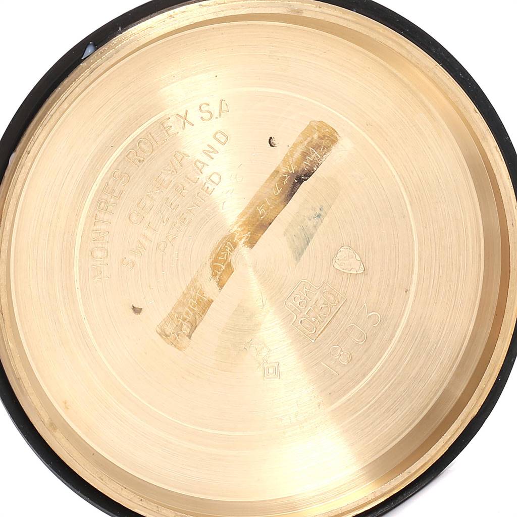 The image shows the inside case back of a Rolex President 1803 Men's Yellow Gold Champagne Dial 1803 Men's Yellow Gold Champagne Dial model watch, with engravings and markings visible.