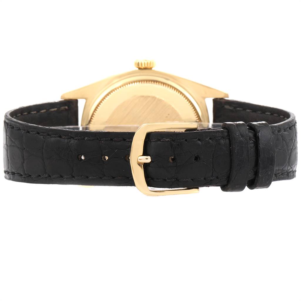 The image shows the back casing and black leather strap with buckle of the Rolex President 1803 Men's Yellow Gold Champagne Dial 1803 Men's Yellow Gold Champagne Dial model watch.