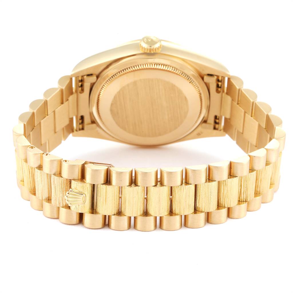 The image shows the back of a Rolex President 18078 Men's Yellow Gold Black Dial 18078 Men's Yellow Gold Black Dial model watch, highlighting the case back, crown, and gold bracelet.