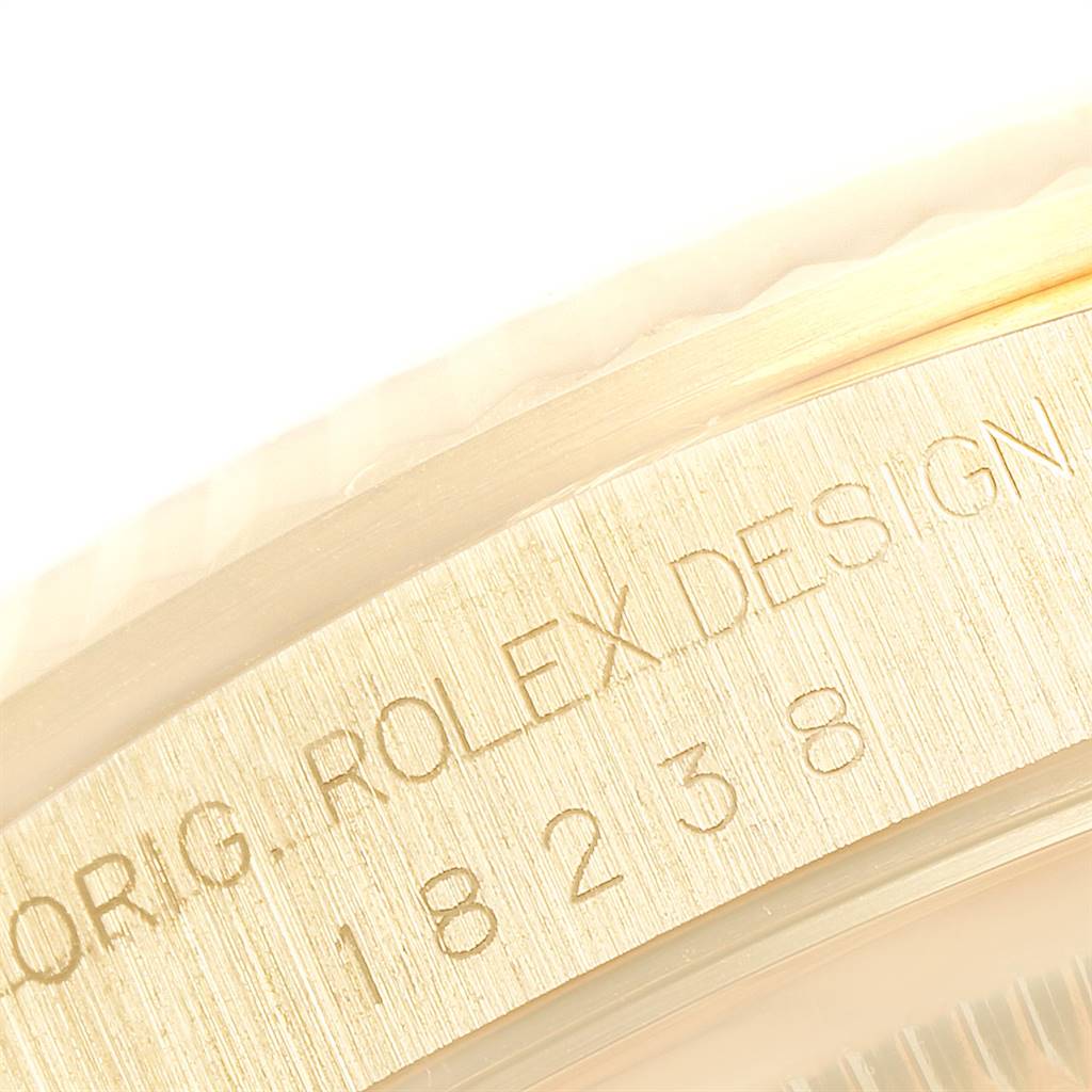 This image shows the engraved case side of a Rolex President 18238 Men's Yellow Gold White Dial 18238 Men's Yellow Gold White Dial model watch, highlighting its model number 18238.