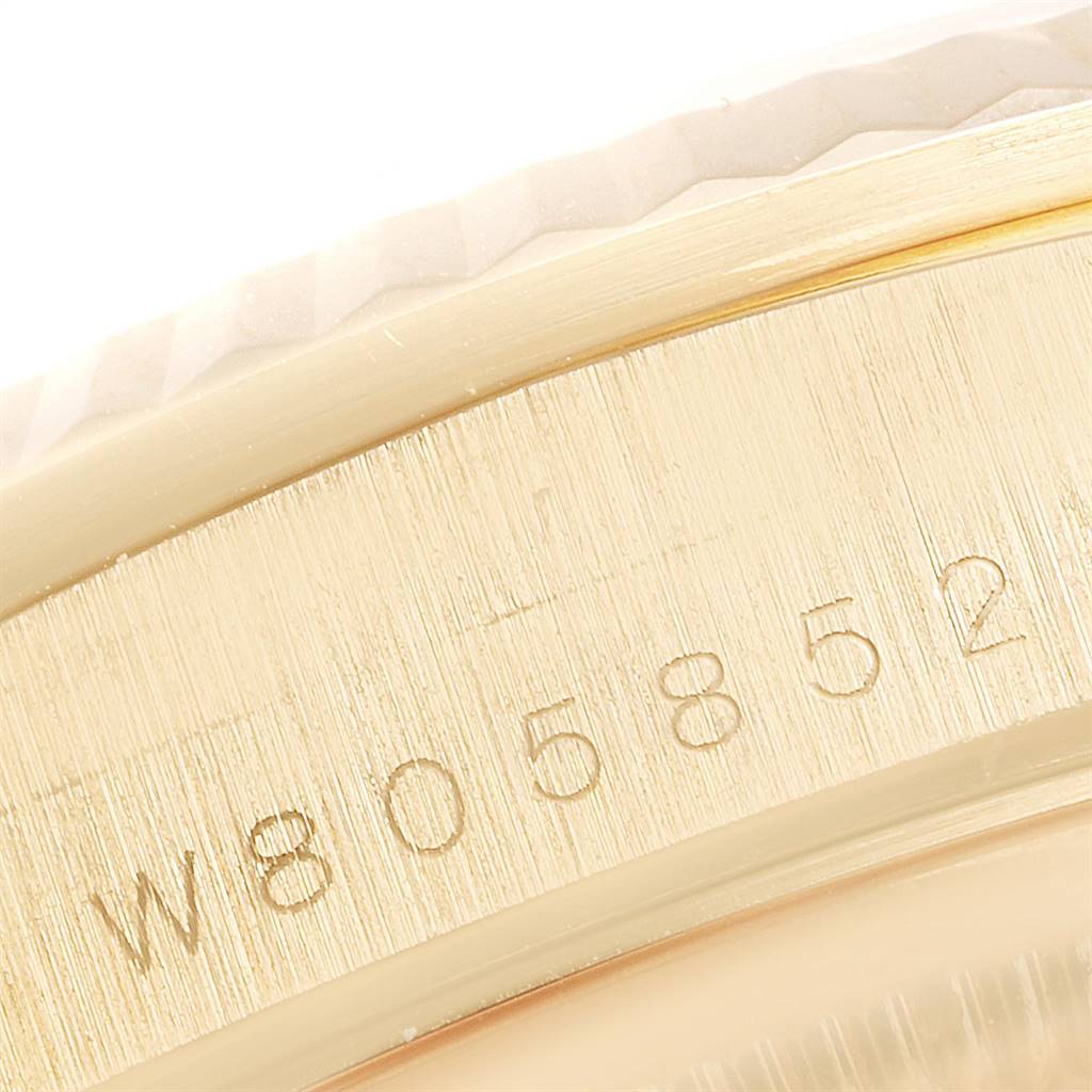 This image shows a close-up of the serial number engraved on the case of a Rolex President 18238 Men's Yellow Gold White Dial 18238 Men's Yellow Gold White Dial model watch.