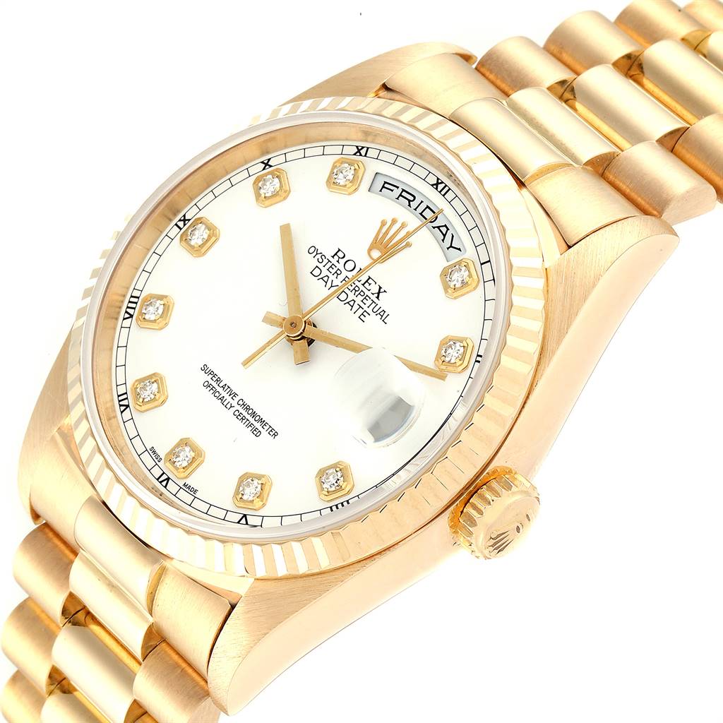 This image shows the Rolex President 18238 Men's Yellow Gold White Dial 18238 Men's Yellow Gold White Dial model watch from an angled top-down perspective, highlighting the face, bezel, and bracelet.