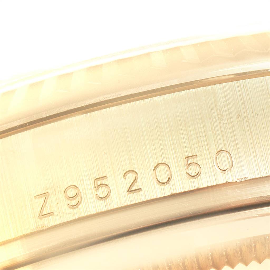 This close-up image shows the serial number engraving on the case of the Rolex President 118238 Men
s Yellow Gold Champagne Dial 118238 Men
s Yellow Gold Champagne Dial model watch.