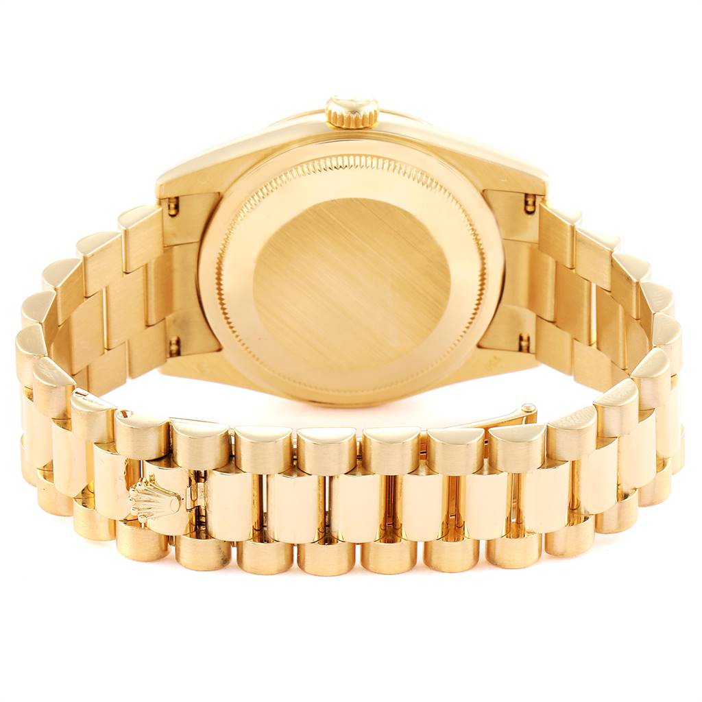 The image shows the back case and bracelet of a Rolex President 118238 Men
s Yellow Gold Champagne Dial 118238 Men
s Yellow Gold Champagne Dial model watch, photographed from the rear.