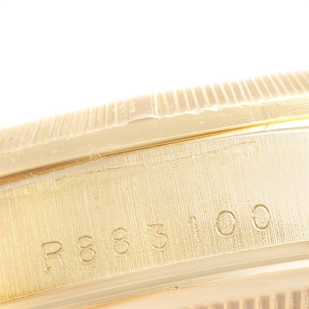This close-up image shows the side view of the case edge, and the rehaut with engravings on a Rolex President 18248 Men's Yellow Gold Black Dial 18248 Men's Yellow Gold Black Dial model watch.