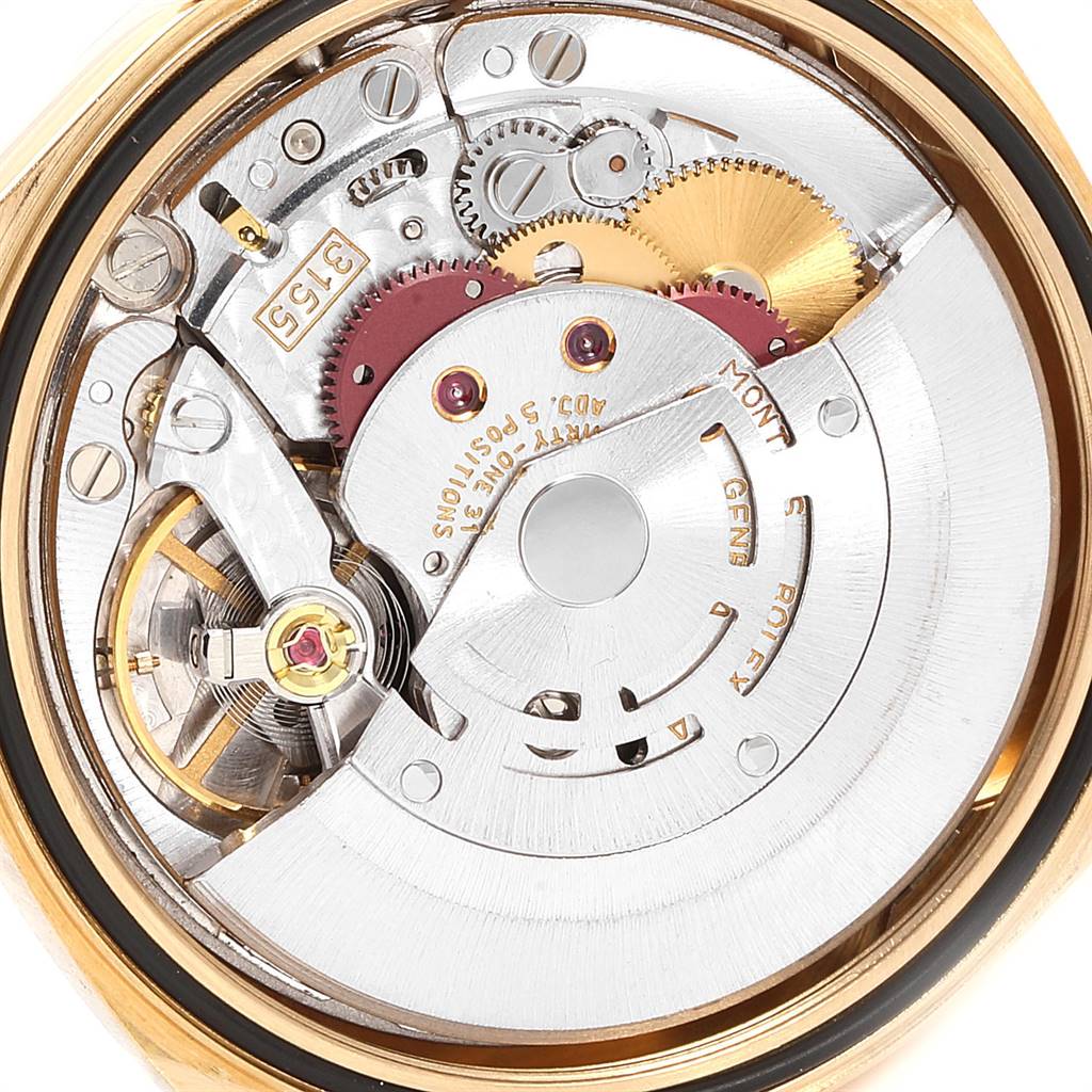 This image shows the intricate internal mechanism of the Rolex President 18248 Men's Yellow Gold Black Dial 18248 Men's Yellow Gold Black Dial model, highlighting its gears and movement parts.