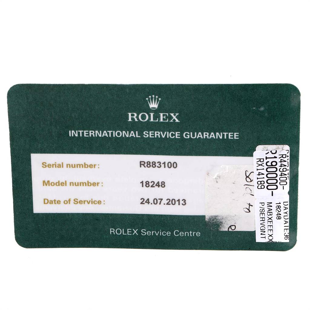 This image shows a Rolex President 18248 Men's Yellow Gold Black Dial 18248 Men's Yellow Gold Black Dial model (18248) International Service Guarantee card.