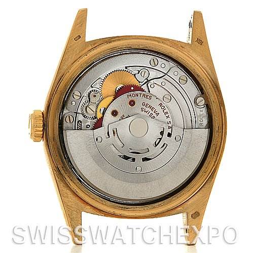 The image shows a back view of the Rolex President 18238 Men's Yellow Gold Champagne Dial 18238 Men's Yellow Gold Champagne Dial model watch, highlighting its internal mechanical movement.