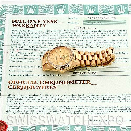 The image shows the Rolex President 18238 Men's Yellow Gold Champagne Dial 18238 Men's Yellow Gold Champagne Dial model watch lying flat, including its face and bracelet, alongside warranty and certification documents.