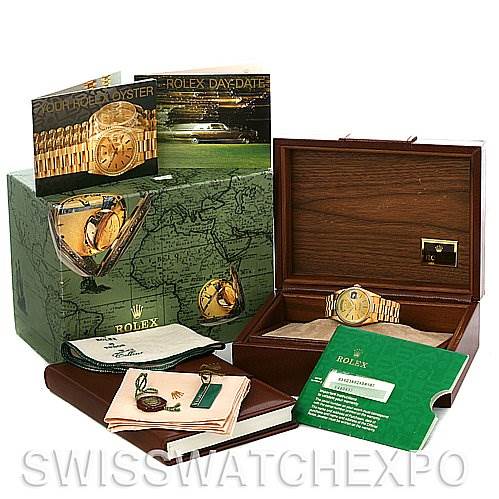 The image displays a Rolex President 18238 Men's Yellow Gold Champagne Dial 18238 Men's Yellow Gold Champagne Dial model watch with its box, brochures, cleaning cloth, and authenticity card.