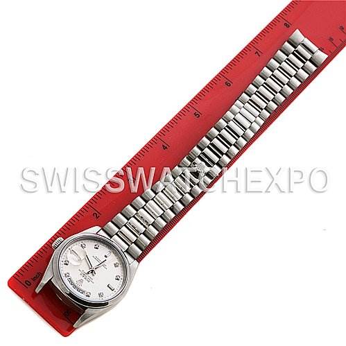 The image shows a Rolex President 18206 Men's Platinum Silver Dial 18206 Men's Platinum Silver Dial model watch, laid flat with the dial and band visible, placed parallel to a red ruler.